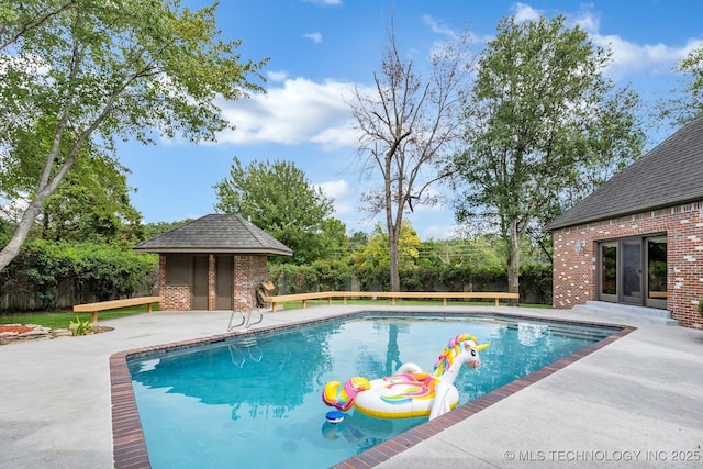 view of pool with a patio, a fenced backyard, french doors, and a fenced in pool