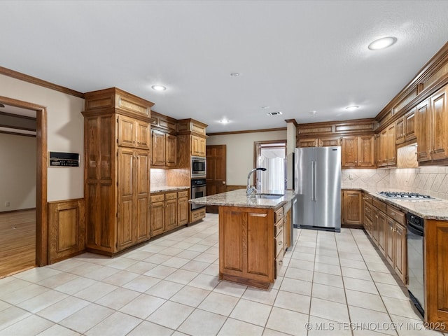 kitchen with crown molding, stainless steel appliances, decorative backsplash, and a sink