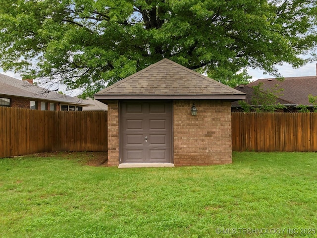 view of shed featuring a fenced backyard