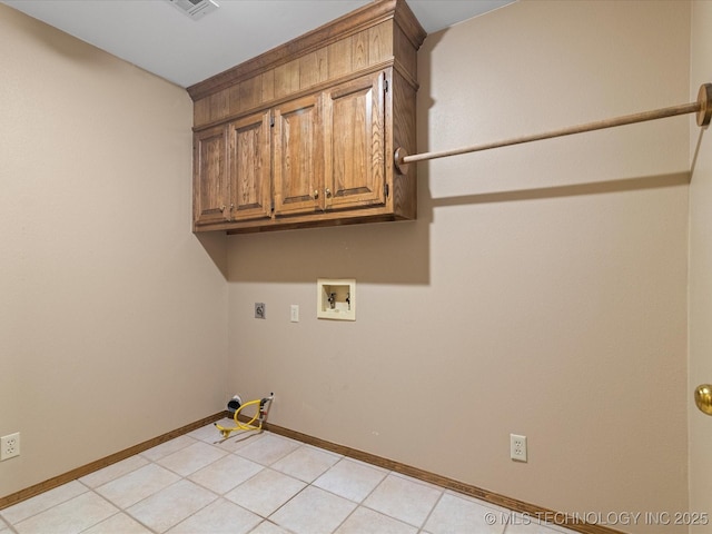 washroom featuring cabinet space, hookup for a washing machine, gas dryer hookup, baseboards, and hookup for an electric dryer