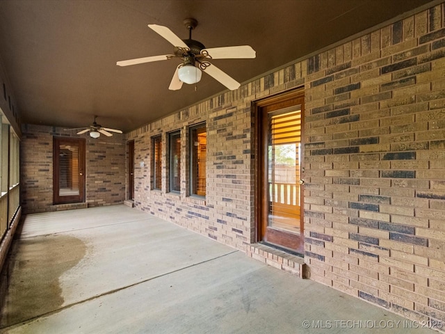 exterior space featuring a ceiling fan