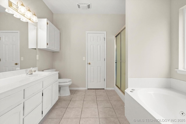 full bathroom featuring a bath, visible vents, a stall shower, vanity, and tile patterned floors