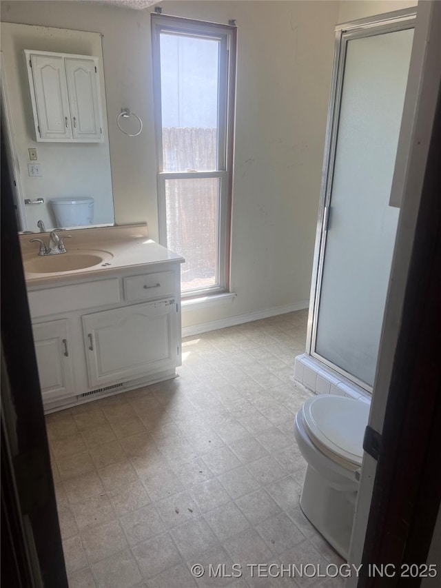 2640 W Fort Worth Pl, Broken Arrow, OK 74012 - full bathroom featuring toilet, vanity, a stall shower, baseboards, and tile patterned floors