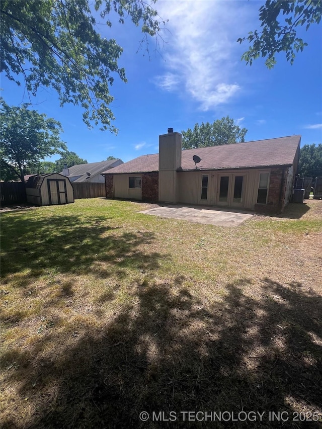 2640 W Fort Worth Pl, Broken Arrow, OK 74012 - back of property with a patio, a storage unit, a chimney, and an outbuilding