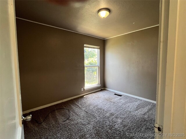304 E 45th Ct, Tulsa, OK 74105 - carpeted spare room featuring baseboards and a textured ceiling