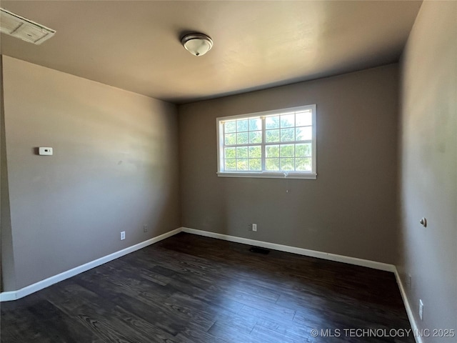 304 E 45th Ct, Tulsa, OK 74105 - unfurnished room featuring dark wood-type flooring and baseboards