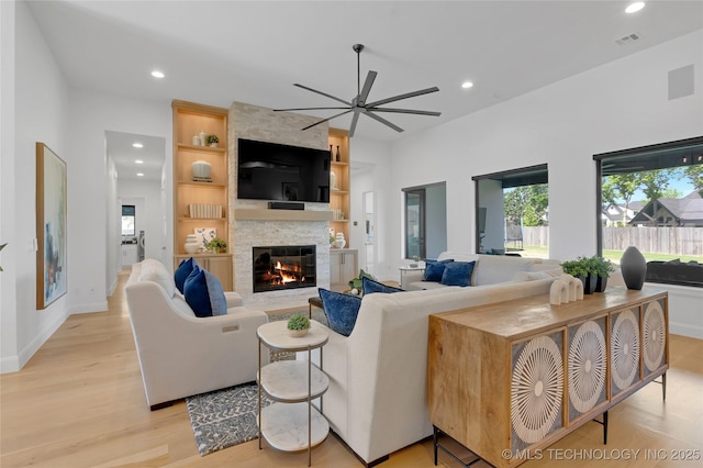 living area with recessed lighting, ceiling fan, and a wealth of natural light