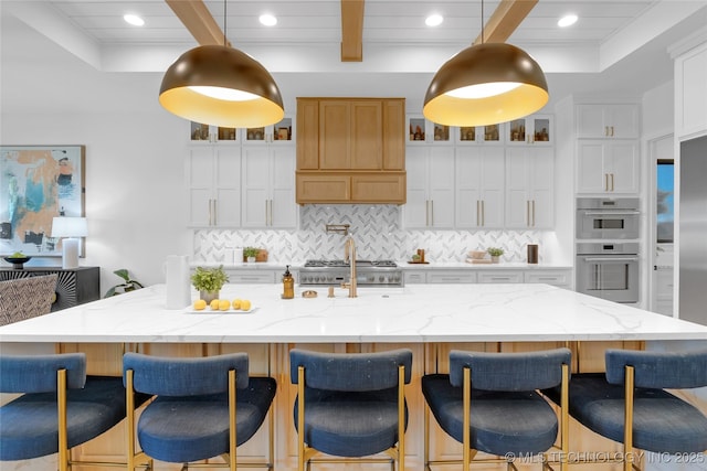 kitchen featuring stainless steel double oven, beam ceiling, recessed lighting, tasteful backsplash, and glass insert cabinets