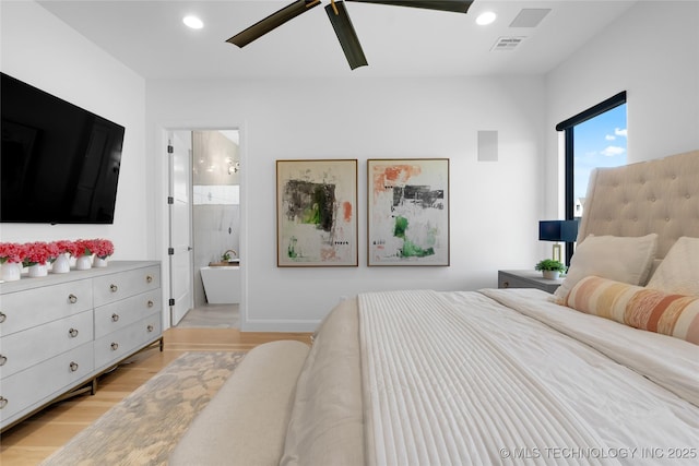 bedroom with ensuite bathroom, recessed lighting, light wood-style flooring, and visible vents