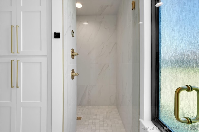 full bathroom with a marble finish shower