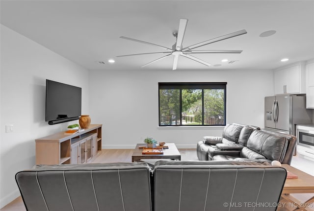 living room with baseboards, recessed lighting, and ceiling fan