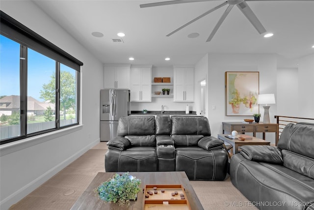 living area with ceiling fan, light colored carpet, visible vents, baseboards, and recessed lighting