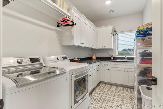 13641 S 27th St E, Bixby, OK 74008 - laundry room with cabinet space, washing machine and dryer, a sink, and light floors