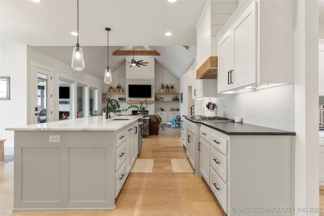 13641 S 27th St E, Bixby, OK 74008 - kitchen with open floor plan, ceiling fan, white cabinets, a sink, and light wood finished floors