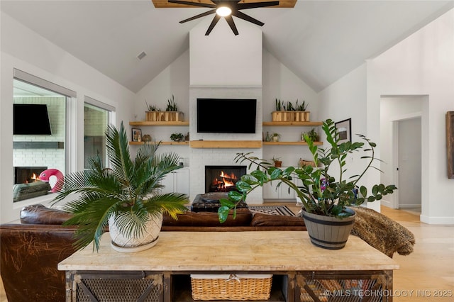 13641 S 27th St E, Bixby, OK 74008 - living room featuring a brick fireplace, a ceiling fan, baseboards, and light wood-type flooring