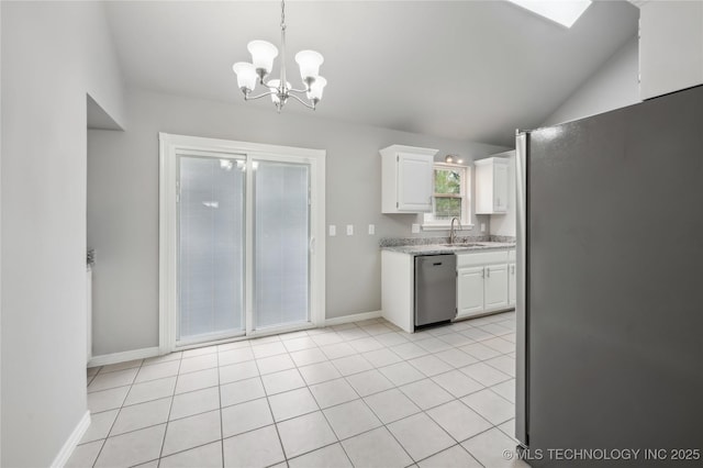 kitchen featuring appliances with stainless steel finishes, hanging light fixtures, a chandelier, white cabinetry, and baseboards