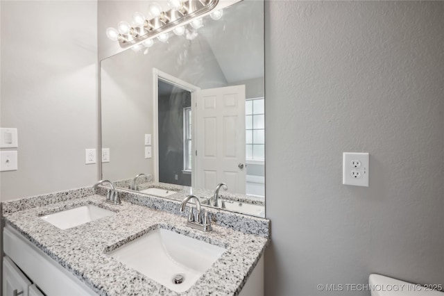 bathroom featuring a sink and toilet