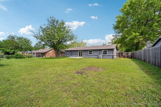 view of yard featuring a fenced backyard
