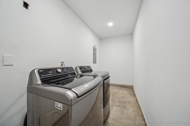 washroom with laundry area and washer and dryer