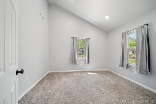 109 S Coo Y Yah St, Pryor, OK 74361 - unfurnished room with visible vents, baseboards, vaulted ceiling, and carpet