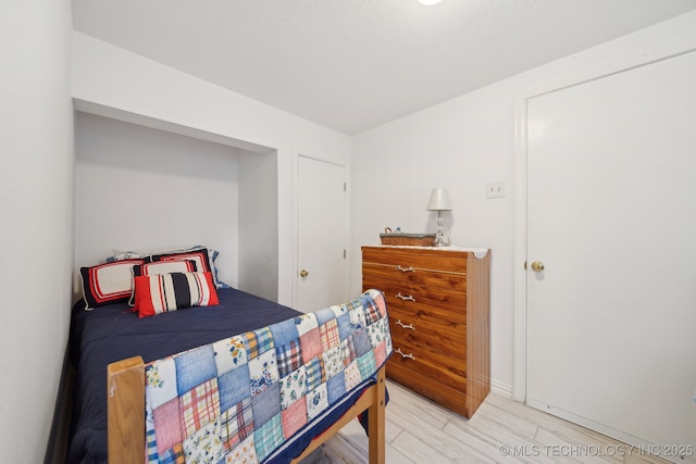 bedroom with light wood-style flooring