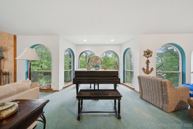sitting room with recessed lighting, plenty of natural light, and carpet