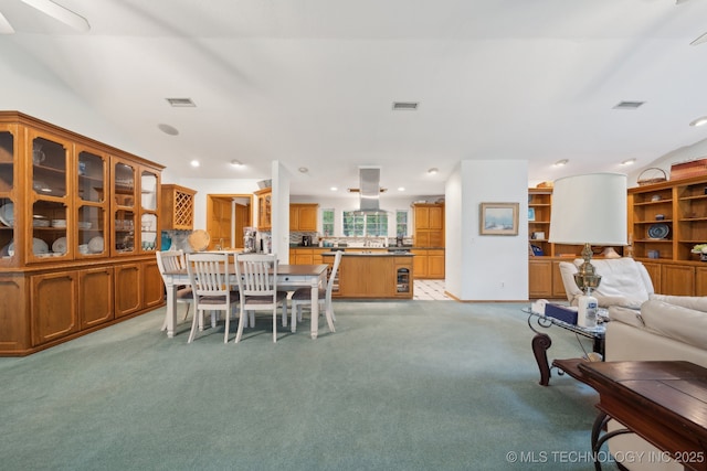 dining space with recessed lighting, visible vents, and light carpet