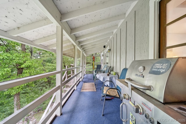exterior space featuring beamed ceiling