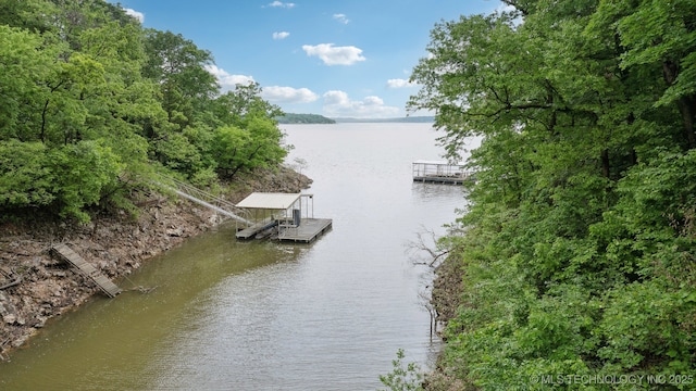 property view of water featuring a floating dock