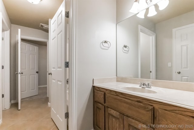 bathroom featuring tile patterned floors, visible vents, and vanity