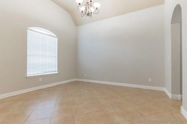 empty room with an inviting chandelier, arched walkways, baseboards, light tile patterned floors, and lofted ceiling