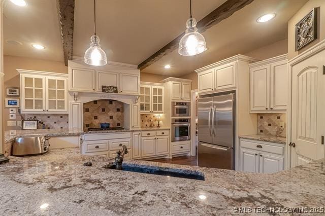 11615 S New Haven Ave, Tulsa, OK 74137 - kitchen featuring backsplash, stainless steel appliances, beamed ceiling, and light stone counters