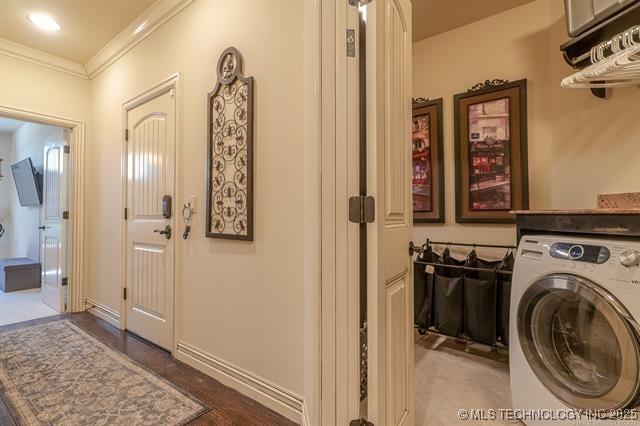11615 S New Haven Ave, Tulsa, OK 74137 - laundry area featuring washer / clothes dryer, crown molding, wood finished floors, and laundry area