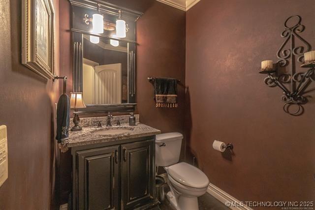 11615 S New Haven Ave, Tulsa, OK 74137 - bathroom with crown molding, toilet, and vanity