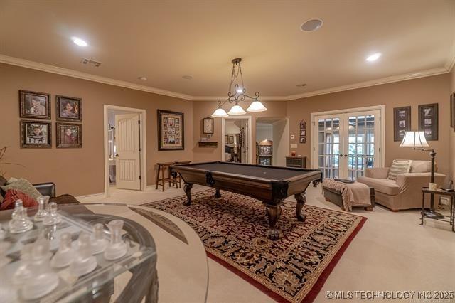 11615 S New Haven Ave, Tulsa, OK 74137 - playroom featuring billiards, french doors, visible vents, crown molding, and light colored carpet