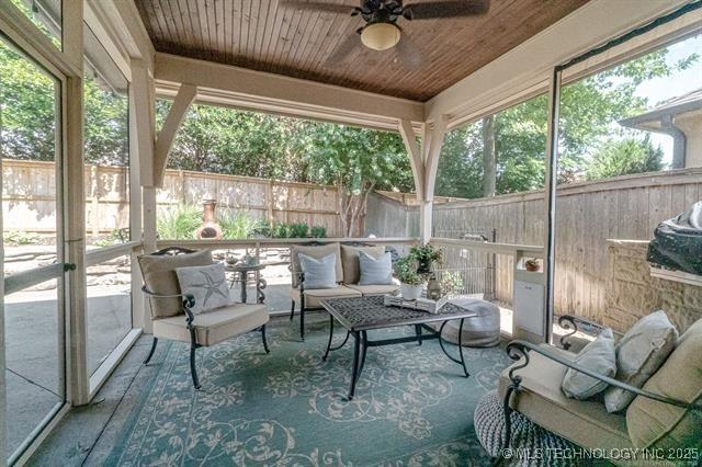 11615 S New Haven Ave, Tulsa, OK 74137 - sunroom / solarium featuring ceiling fan, a wealth of natural light, and an outdoor hangout area