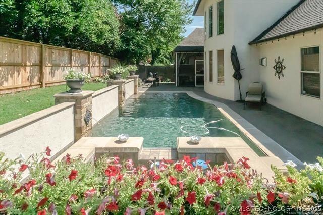 11615 S New Haven Ave, Tulsa, OK 74137 - view of swimming pool with a fenced in pool, a fenced backyard, and a patio area