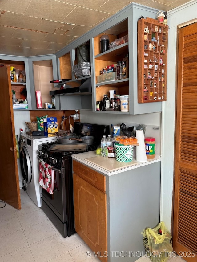 kitchen with light countertops, open shelves, and black range with gas stovetop