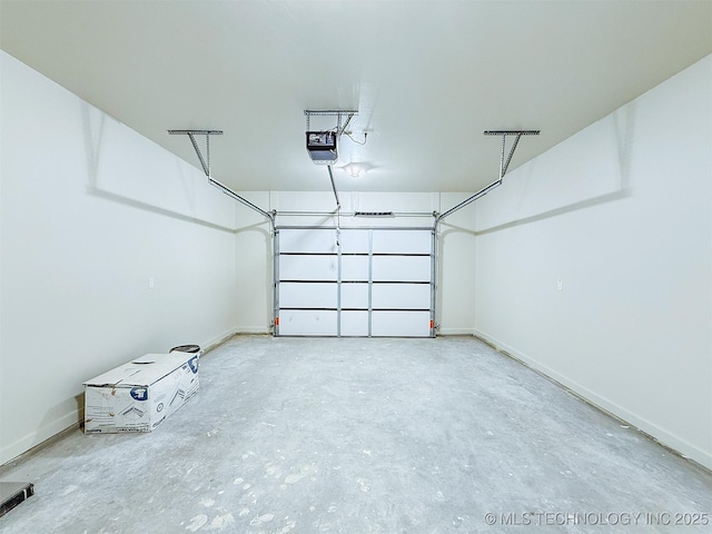 garage featuring baseboards and a garage door opener