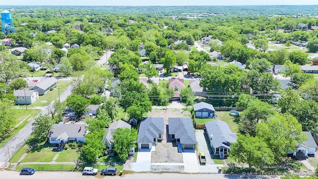 birds eye view of property featuring a view of trees and a residential view