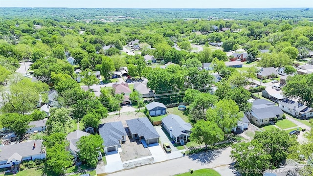 drone / aerial view with a residential view and a forest view
