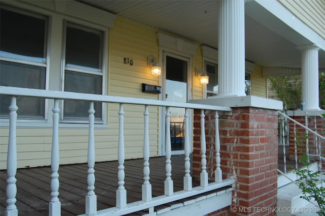 view of property exterior with covered porch