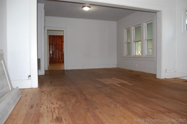 spare room with hardwood / wood-style flooring
