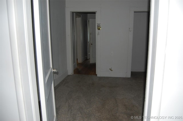 hallway with carpet
