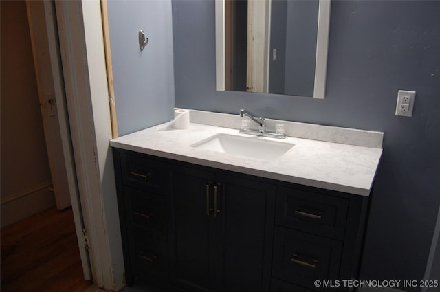bathroom featuring vanity and wood finished floors