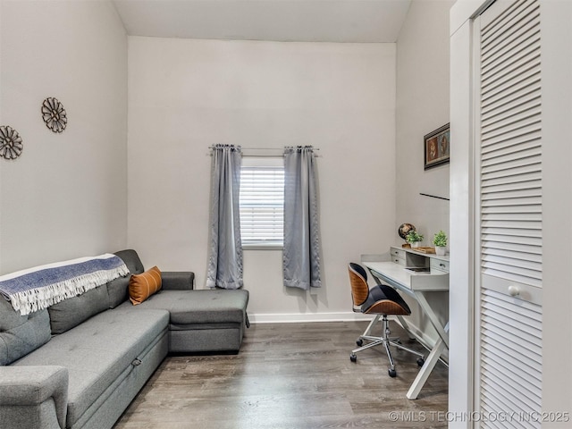 office area with baseboards and wood finished floors