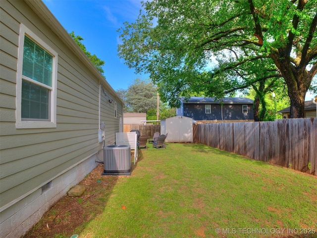 view of yard featuring a fenced backyard, an outbuilding, central air condition unit, and a storage shed