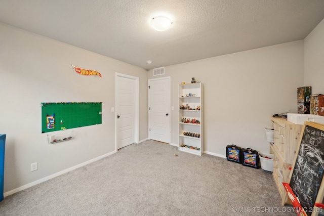 recreation room featuring visible vents, carpet flooring, and baseboards