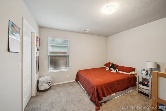 bedroom featuring visible vents, carpet flooring, and baseboards