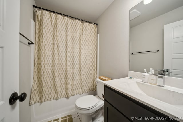 full bathroom with toilet, tile patterned flooring, and vanity